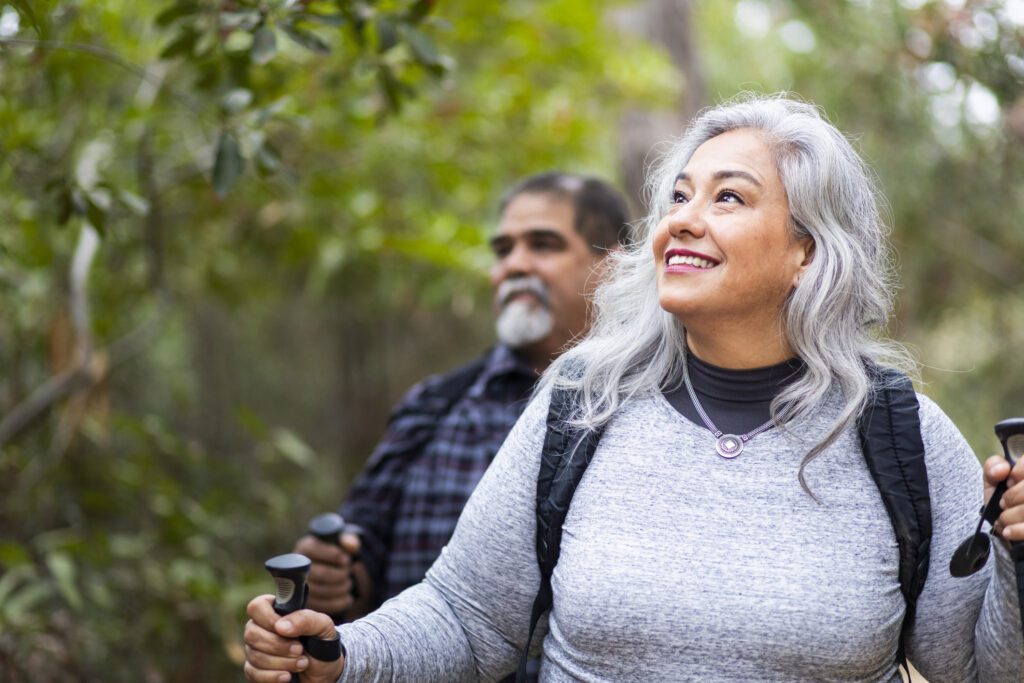 A senior mexican couple hiking